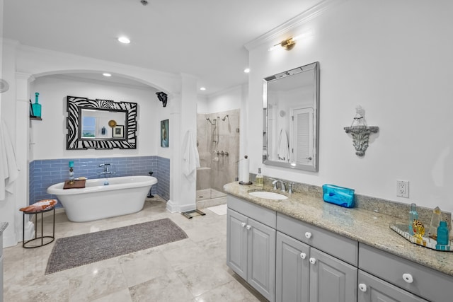 bathroom with independent shower and bath, vanity, tile patterned floors, and ornamental molding