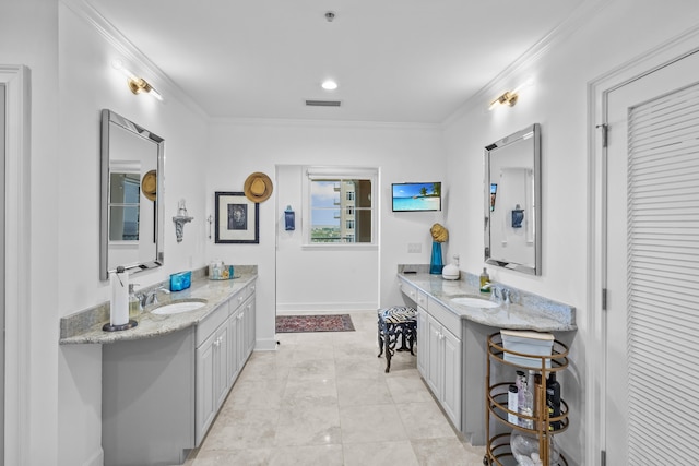 bathroom with tile patterned flooring, dual vanity, and crown molding