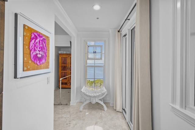 hall featuring crown molding and light tile patterned floors