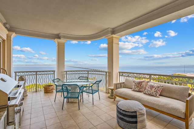 view of patio / terrace featuring a balcony, a water view, and an outdoor hangout area