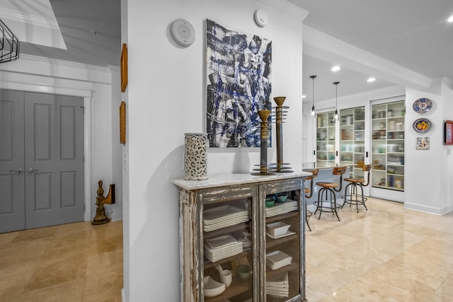 interior space with hanging light fixtures and light tile patterned floors