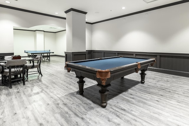 rec room with pool table, light hardwood / wood-style flooring, and crown molding