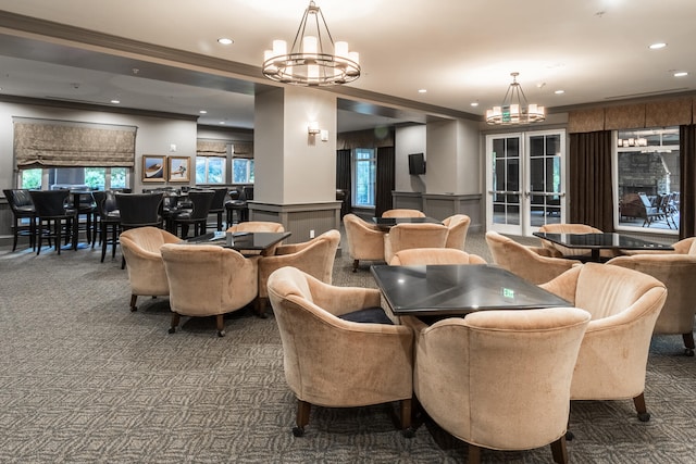 carpeted dining space with an inviting chandelier and crown molding