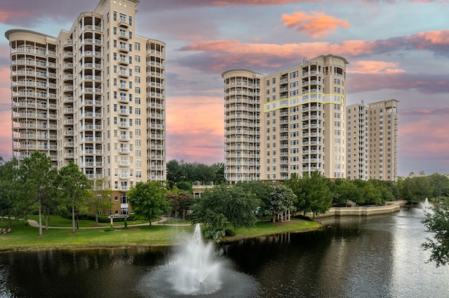 outdoor building at dusk featuring a water view