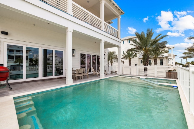 view of swimming pool featuring a patio area