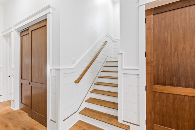 stairway featuring light hardwood / wood-style flooring