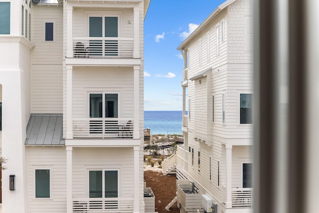 view of building exterior with a water view