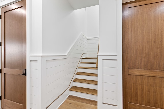 stairway featuring light wood-type flooring