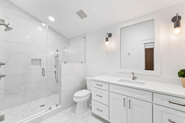 bathroom featuring a shower with door, vanity, tile flooring, vaulted ceiling, and toilet