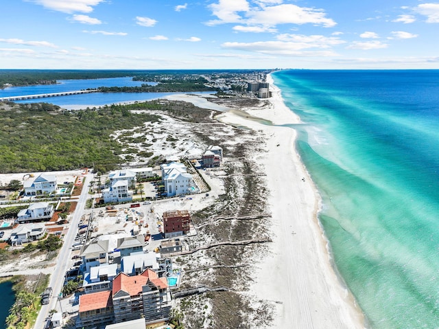 birds eye view of property with a view of the beach and a water view