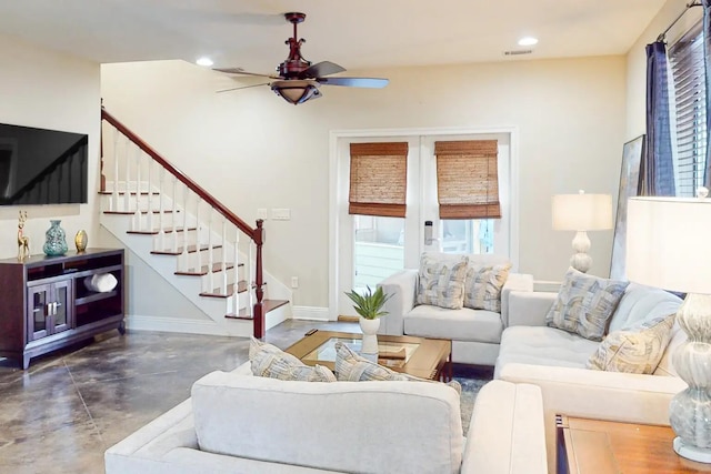 living room with ceiling fan and french doors