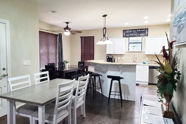 dining space with ceiling fan