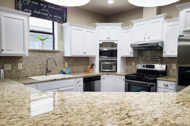 kitchen with tasteful backsplash, appliances with stainless steel finishes, and white cabinetry