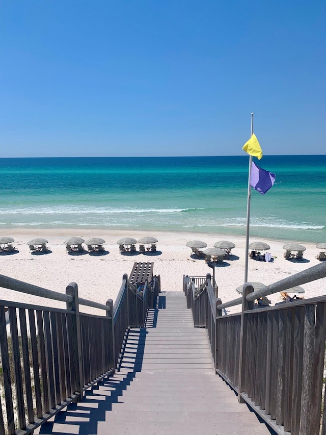 property view of water featuring a beach view