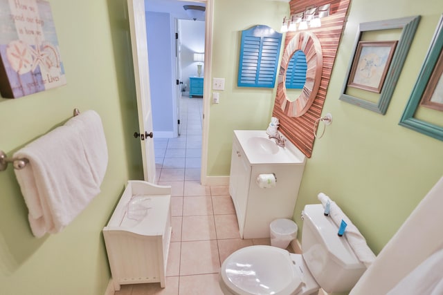 bathroom featuring vanity, toilet, and tile flooring