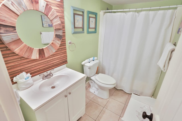 bathroom featuring toilet, tile flooring, and large vanity