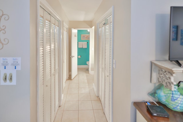 hallway featuring light tile floors