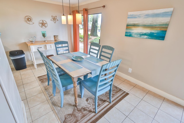 tiled dining room with ornamental molding