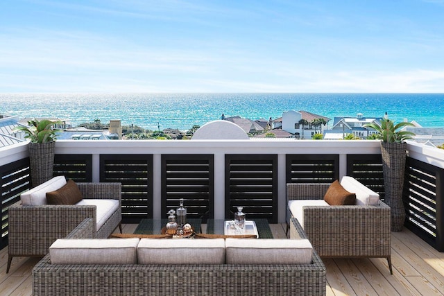 balcony featuring a water view and an outdoor living space