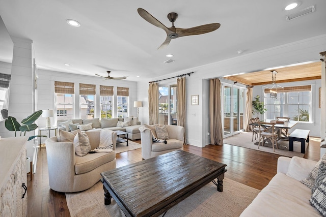 living room featuring hardwood / wood-style flooring and ceiling fan