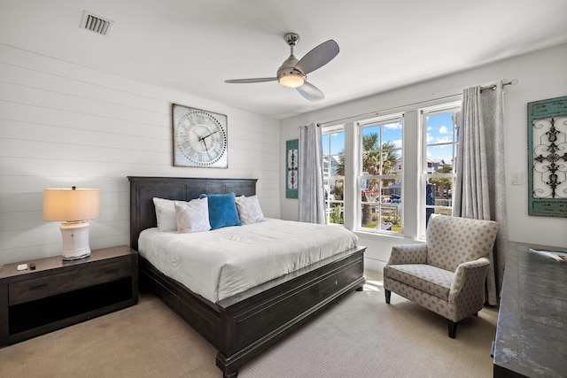 bedroom with ceiling fan and carpet