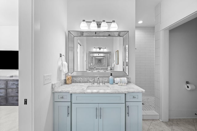 bathroom with vanity and tile floors