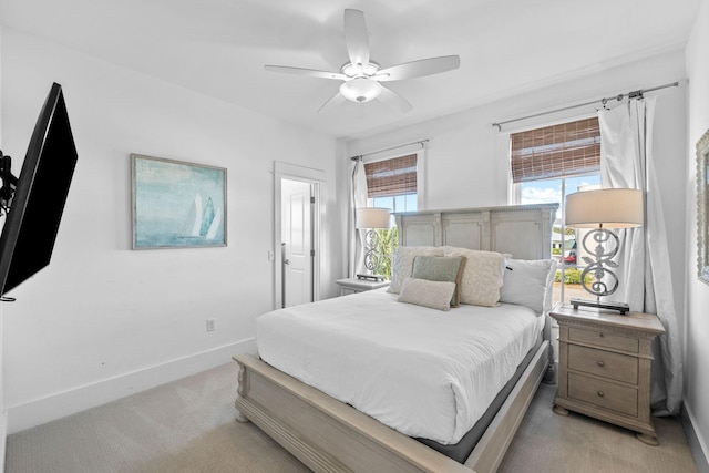 bedroom with light colored carpet and ceiling fan