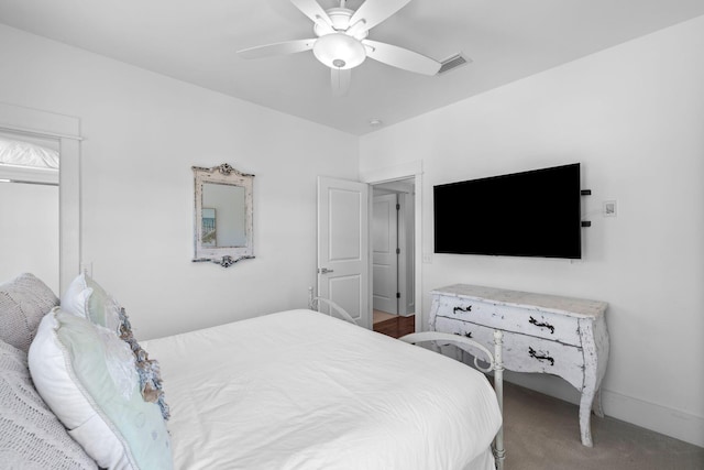 carpeted bedroom with ceiling fan