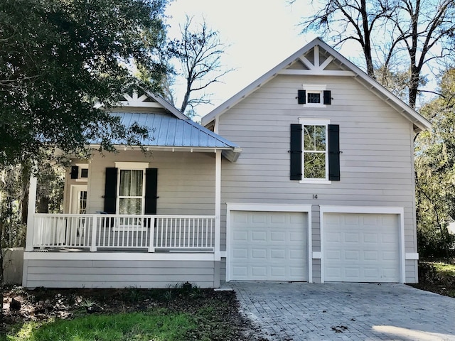 view of front of home with a garage and covered porch