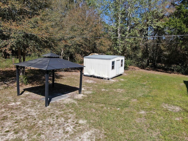 view of yard featuring a storage shed and a gazebo