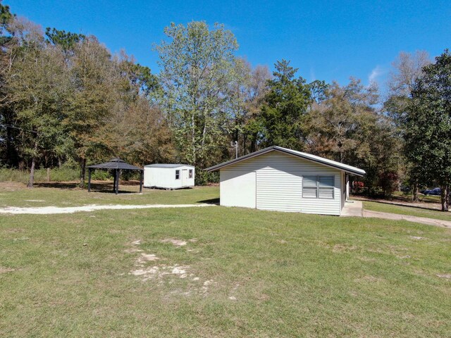 view of home's exterior with a lawn