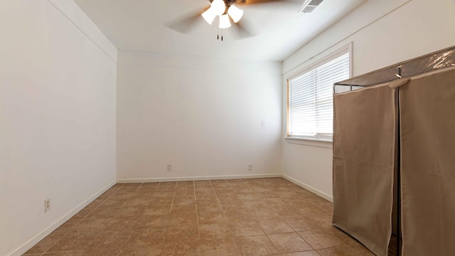 interior space featuring ceiling fan and light tile floors