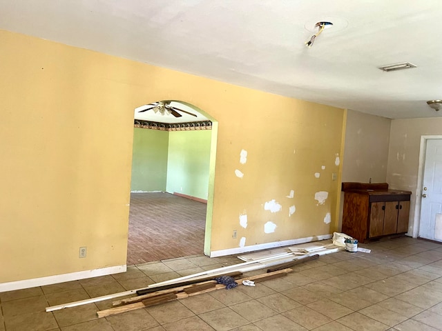 spare room featuring ceiling fan and hardwood / wood-style floors