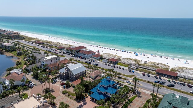 bird's eye view featuring a view of the beach and a water view