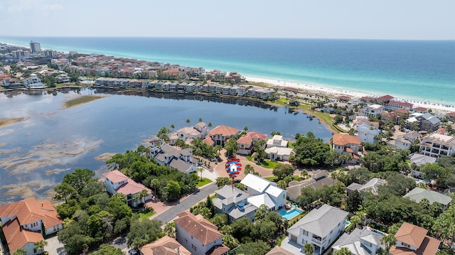 bird's eye view featuring a beach view and a water view