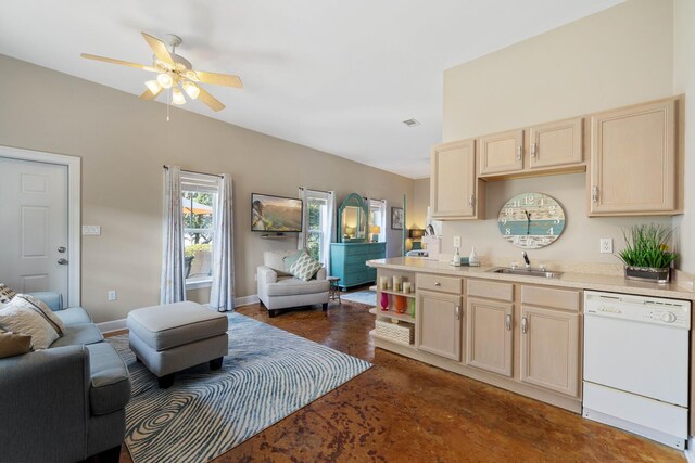 kitchen with dishwasher, light brown cabinetry, sink, and ceiling fan