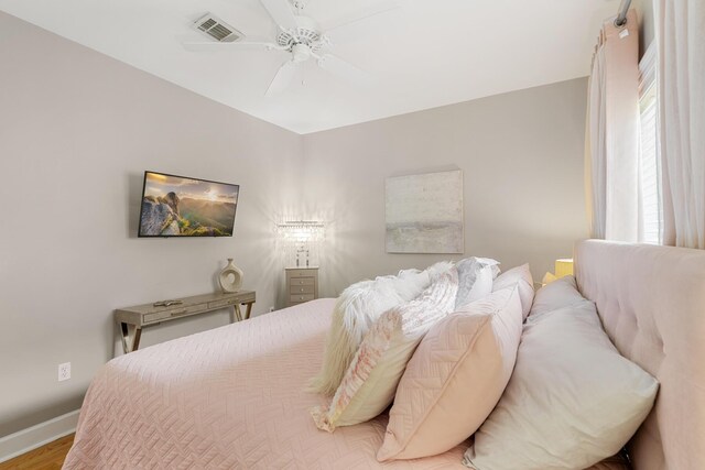 bedroom featuring ceiling fan and light hardwood / wood-style floors