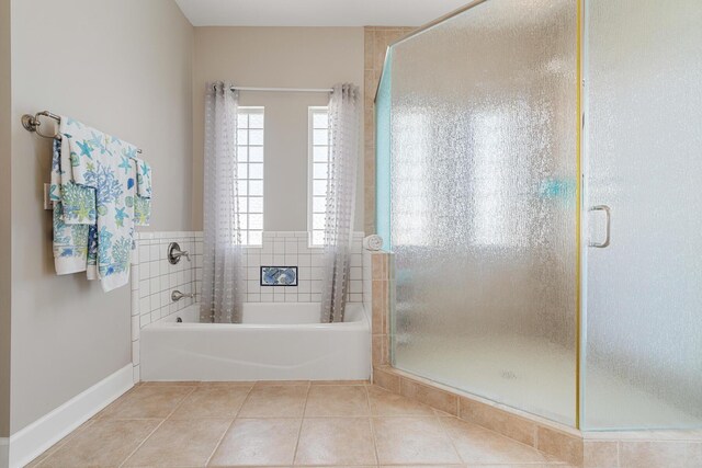 bathroom featuring tile patterned flooring and plus walk in shower