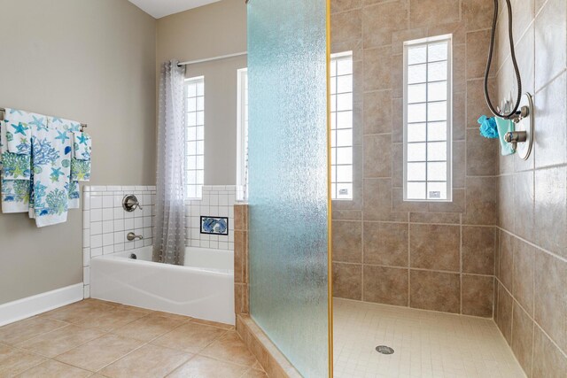 bathroom featuring tile patterned flooring and shower with separate bathtub