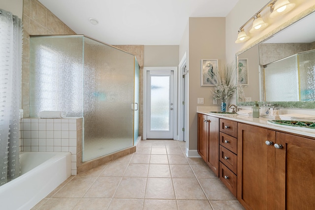 bathroom featuring tile patterned floors, plus walk in shower, and vanity