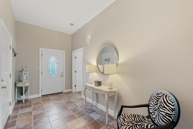 entrance foyer with high vaulted ceiling