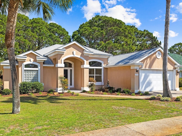 ranch-style home with a front lawn and a garage