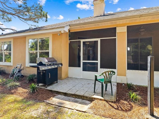 back of house featuring a patio and a sunroom