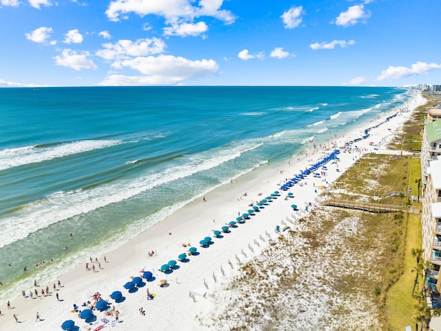 drone / aerial view with a water view and a view of the beach