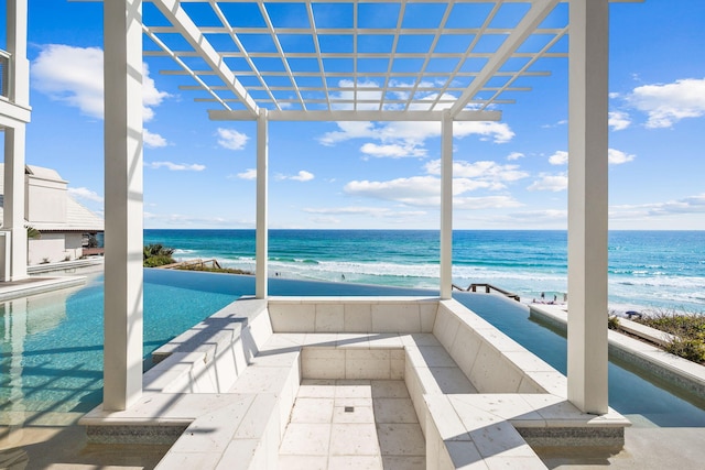 unfurnished sunroom with a water view