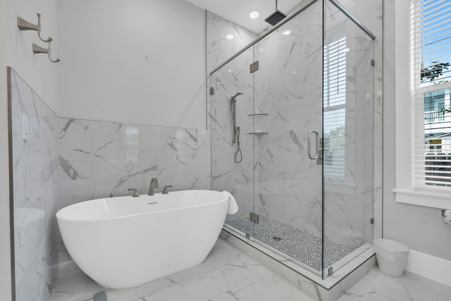 bathroom featuring tile walls, tile flooring, and independent shower and bath