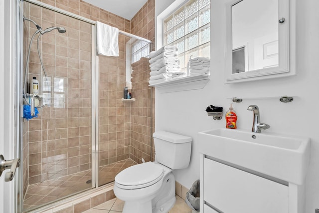 bathroom with walk in shower, toilet, tile flooring, and vanity