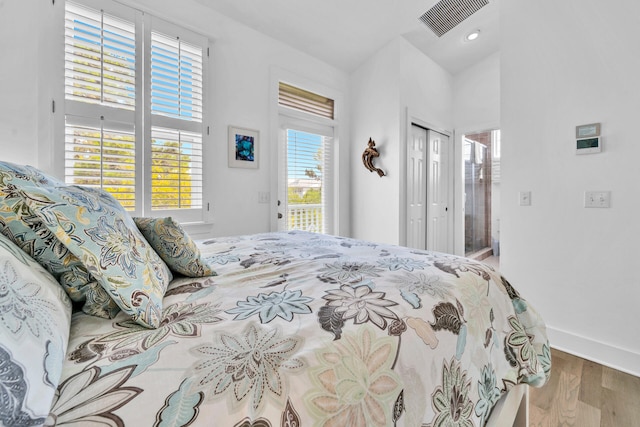 bedroom with a closet and light hardwood / wood-style floors