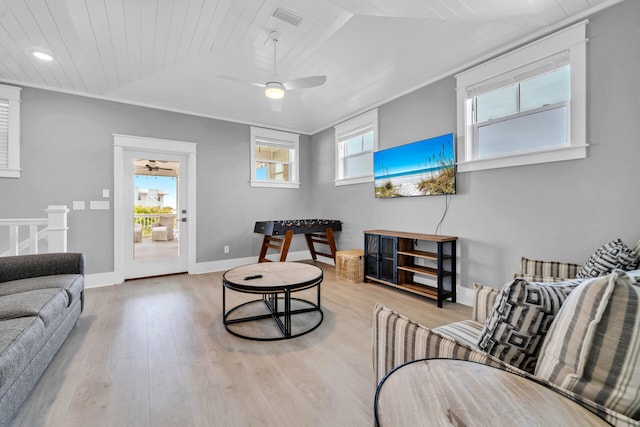 living room featuring light hardwood / wood-style floors and ceiling fan