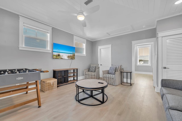 living room with light hardwood / wood-style floors and ceiling fan